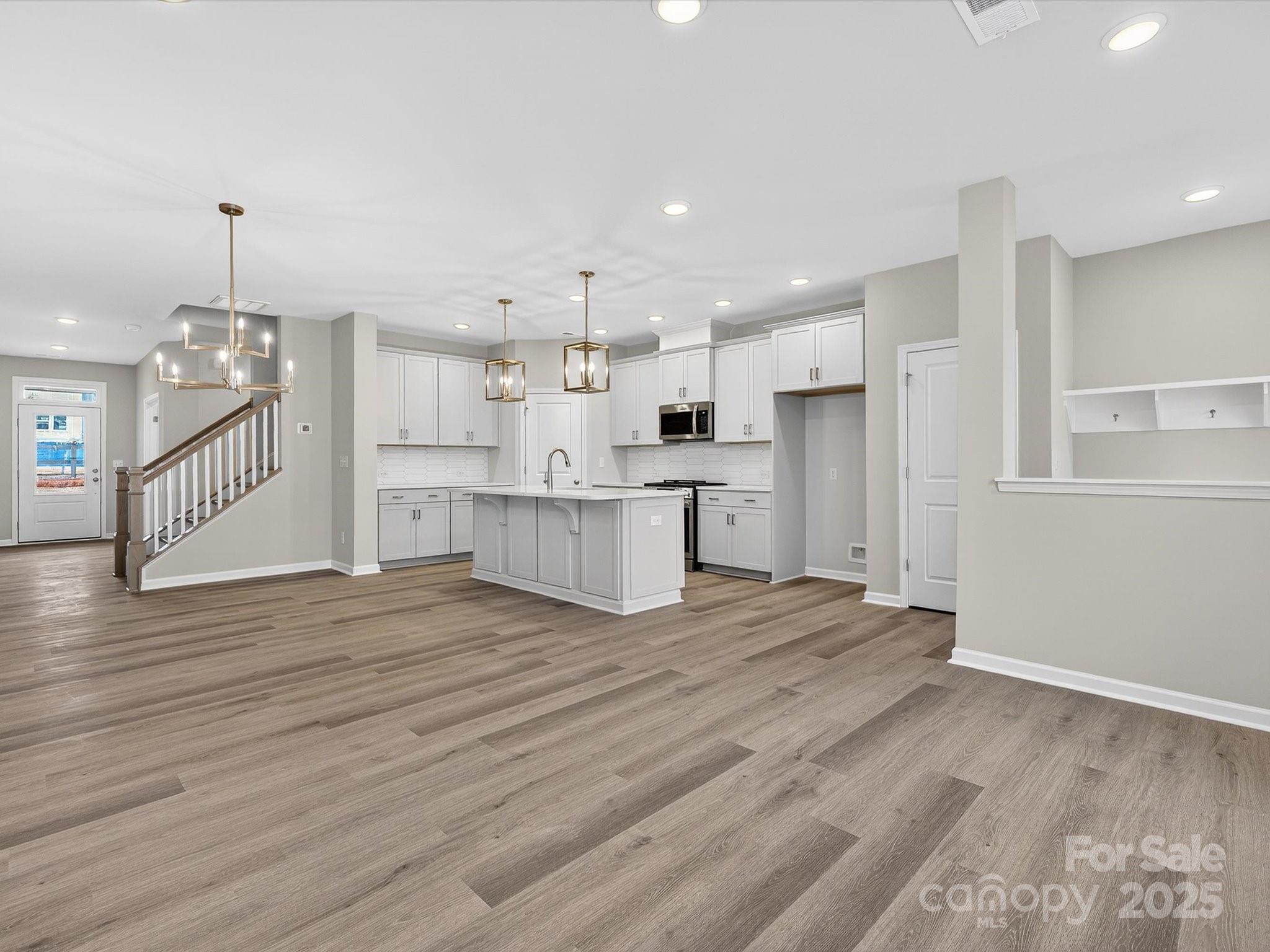 11439 Prosperity Church Road Huntersville, NC 28078 - Photo 14 of 34 a view of kitchen with wooden floor and electronic appliances