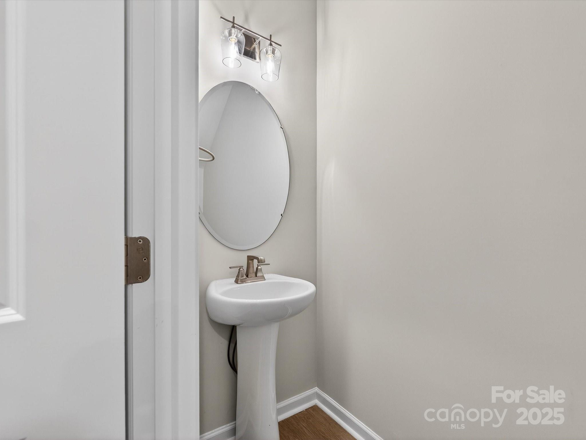 11439 Prosperity Church Road Huntersville, NC 28078 - Photo 16 of 34 a bathroom with a sink and mirror