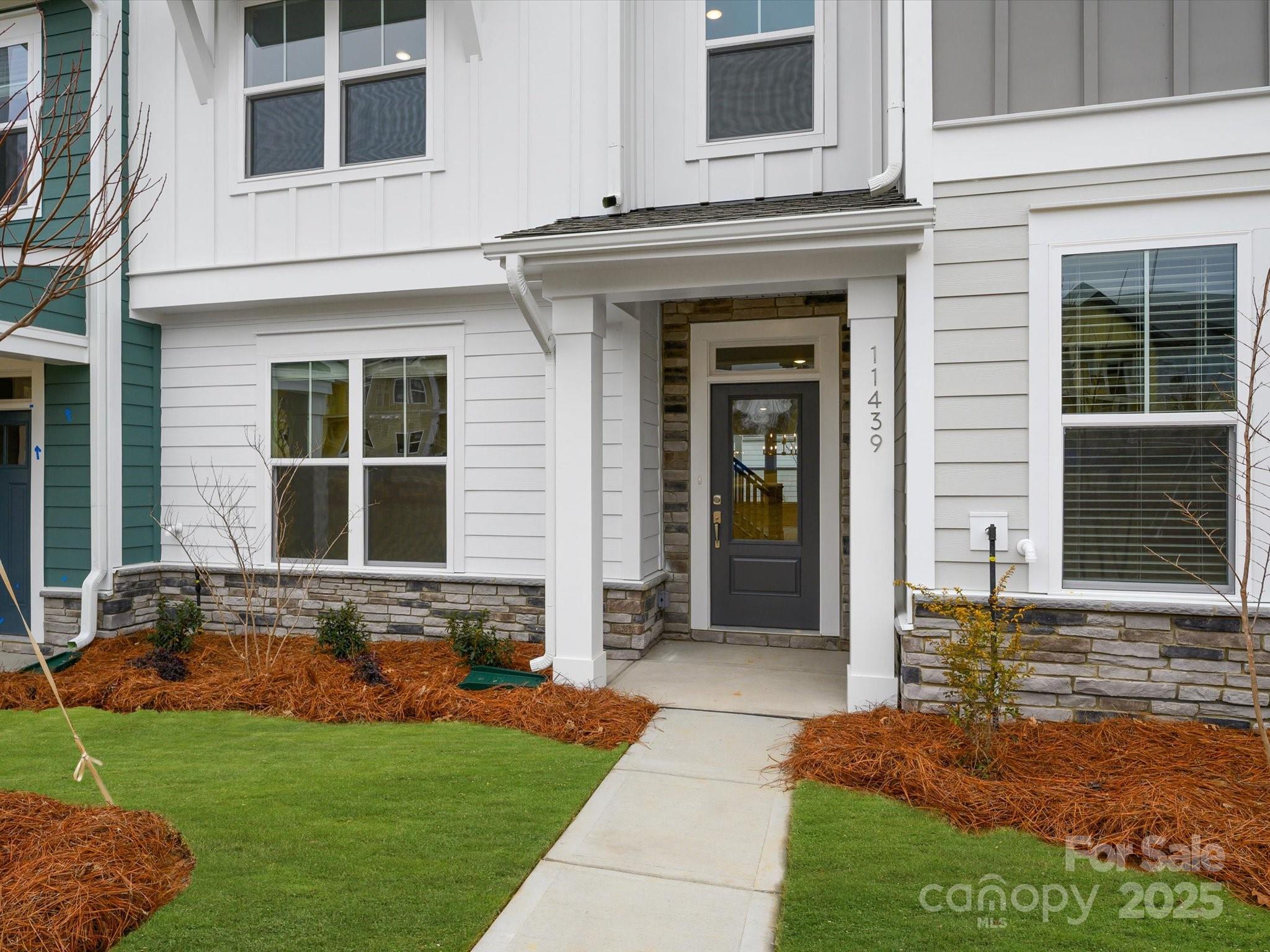 11439 Prosperity Church Road Huntersville, NC 28078 - Photo 2 of 34 a front view of a house with a yard