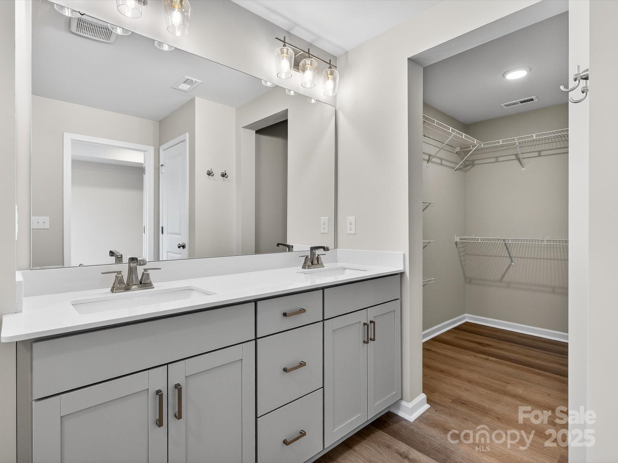 11439 Prosperity Church Road Huntersville, NC 28078 - Photo 22 of 34 a bathroom with a double vanity sink mirror and shower