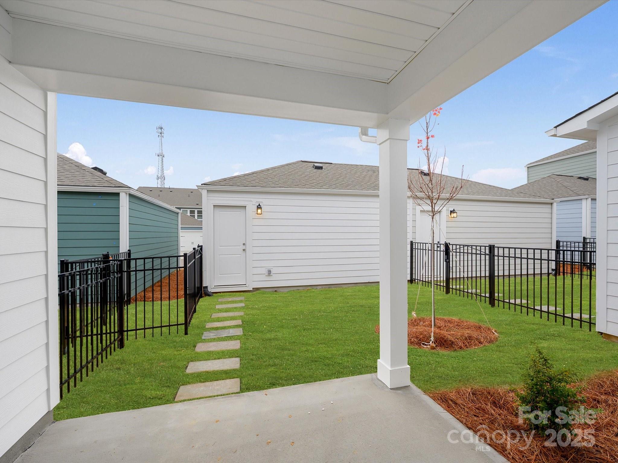 11439 Prosperity Church Road Huntersville, NC 28078 - Photo 27 of 34 a front view of a house with a garden and yard