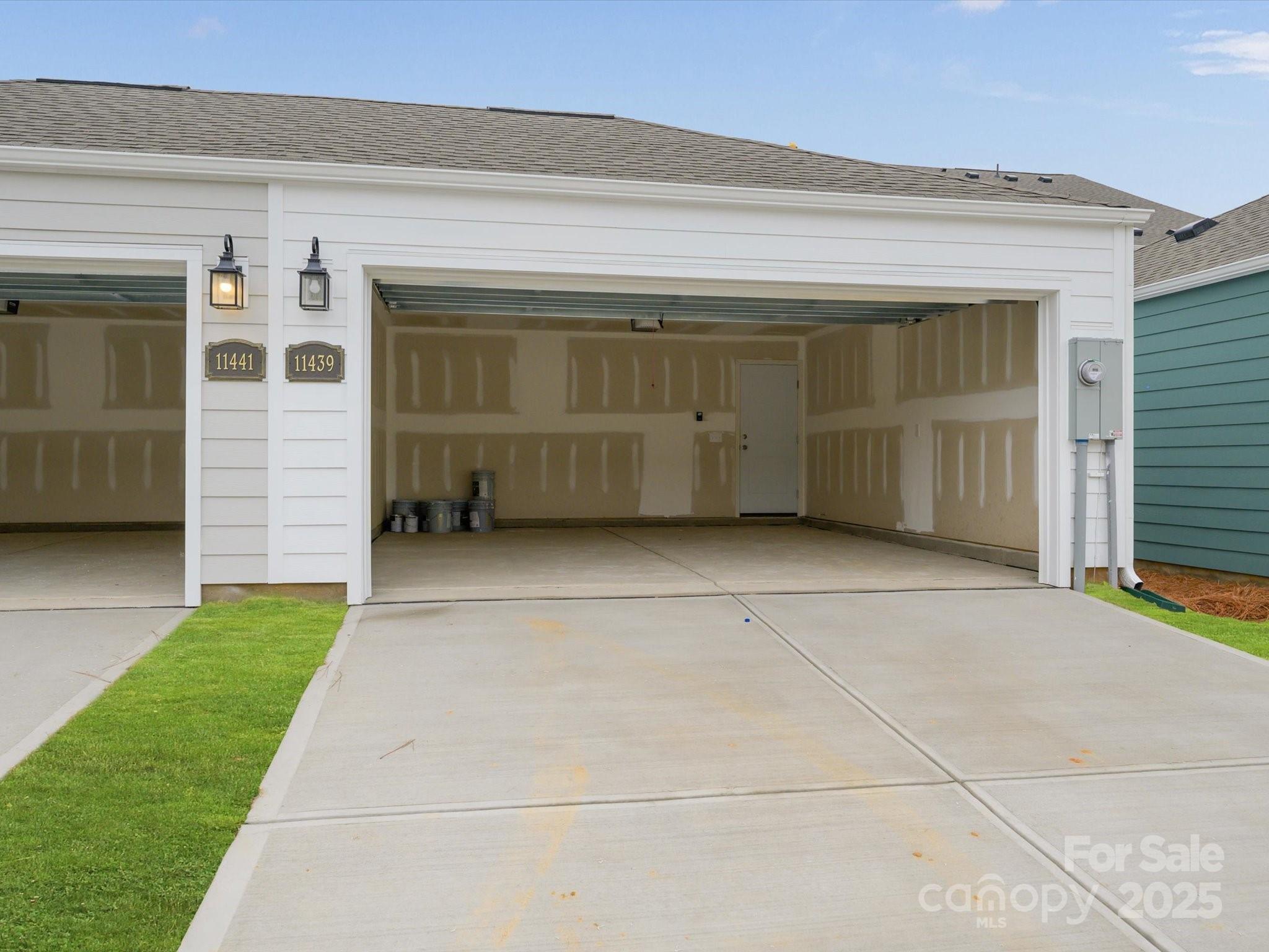 11439 Prosperity Church Road Huntersville, NC 28078 - Photo 29 of 34 a view of garage with a car parked in front of it