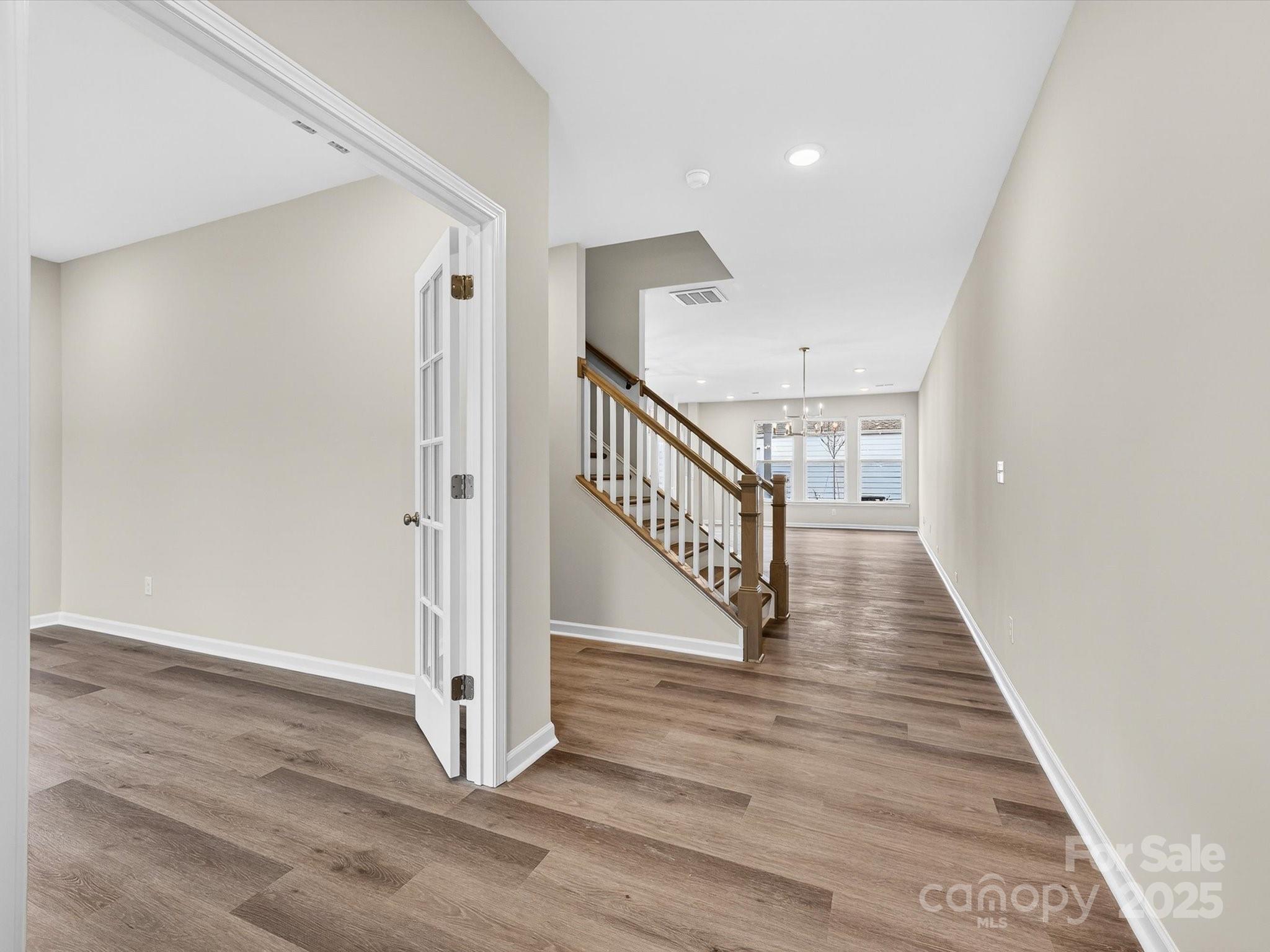 11439 Prosperity Church Road Huntersville, NC 28078 - Photo 4 of 34 a view of a hallway with wooden floor and entryway