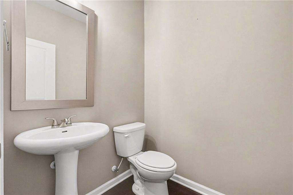 4475 Clubside Drive Gainesville, GA 30504 - Photo 15 of 36 a bathroom with a sink and a toilet