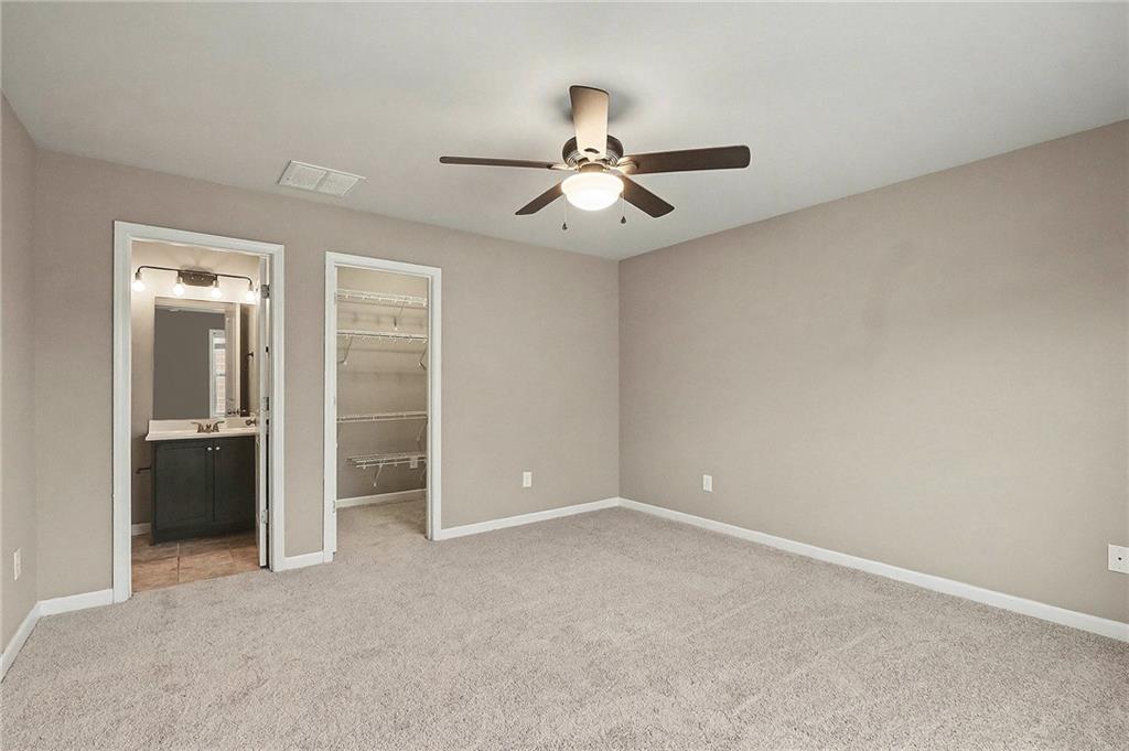 4475 Clubside Drive Gainesville, GA 30504 - Photo 22 of 36 an empty room with closet and windows