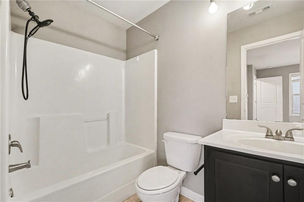 4475 Clubside Drive Gainesville, GA 30504 - Photo 30 of 36 a bathroom with a sink toilet and shower