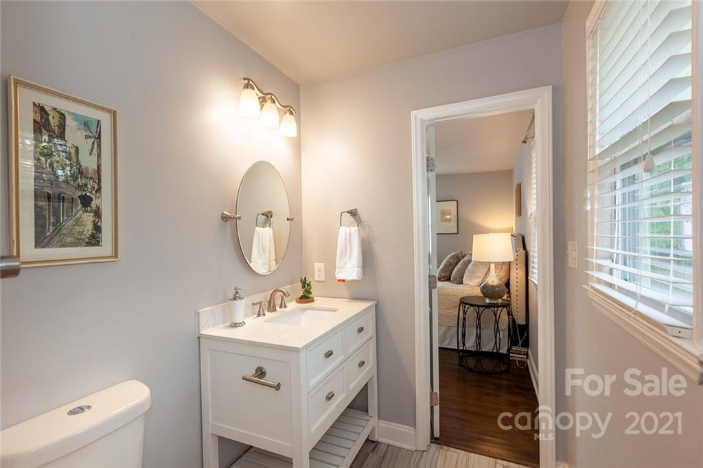 5110 Auburndale Road Charlotte, NC 28205 - Photo 19 of 30 a bathroom with a toilet sink and mirror