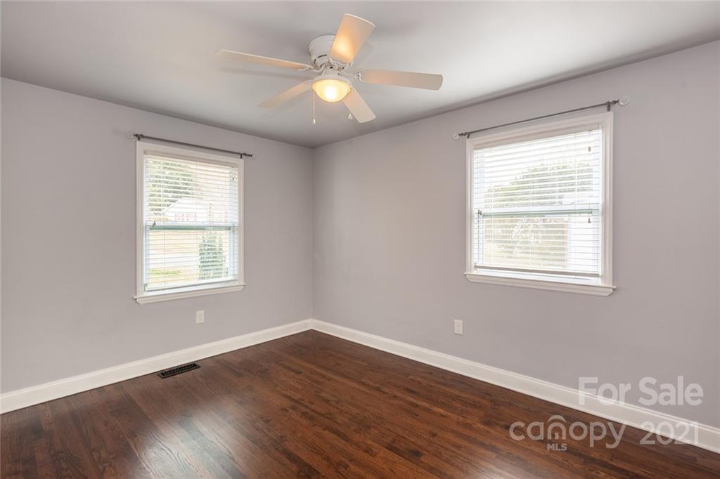 5110 Auburndale Road Charlotte, NC 28205 - Photo 20 of 30 a view of an empty room with wooden floor and a window