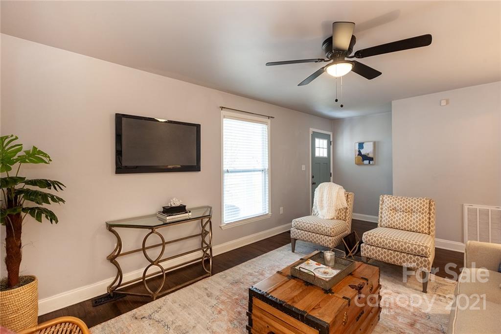 5110 Auburndale Road Charlotte, NC 28205 - Photo 3 of 30 a living room with furniture and a flat screen tv