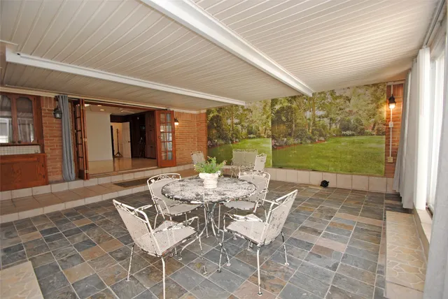 a bedroom with furniture and wooden floor