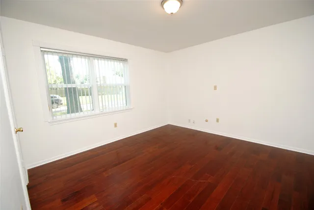 a bathroom with a sink a light fixture and a mirror