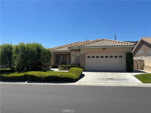 a view of a house with a yard and garage