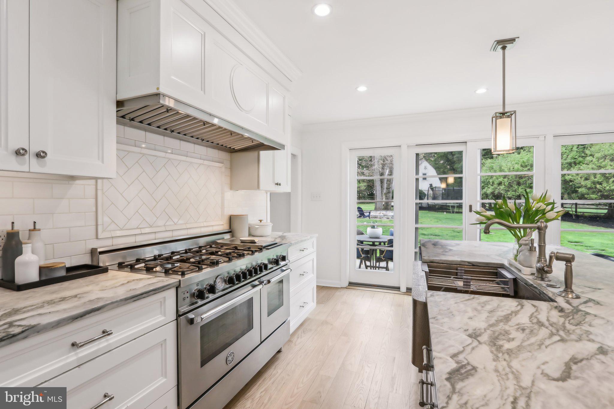 410 North Valley Forge Road Devon, PA 19333 - Photo 14 of 84 a kitchen with stainless steel appliances granite countertop a stove a sink and a refrigerator