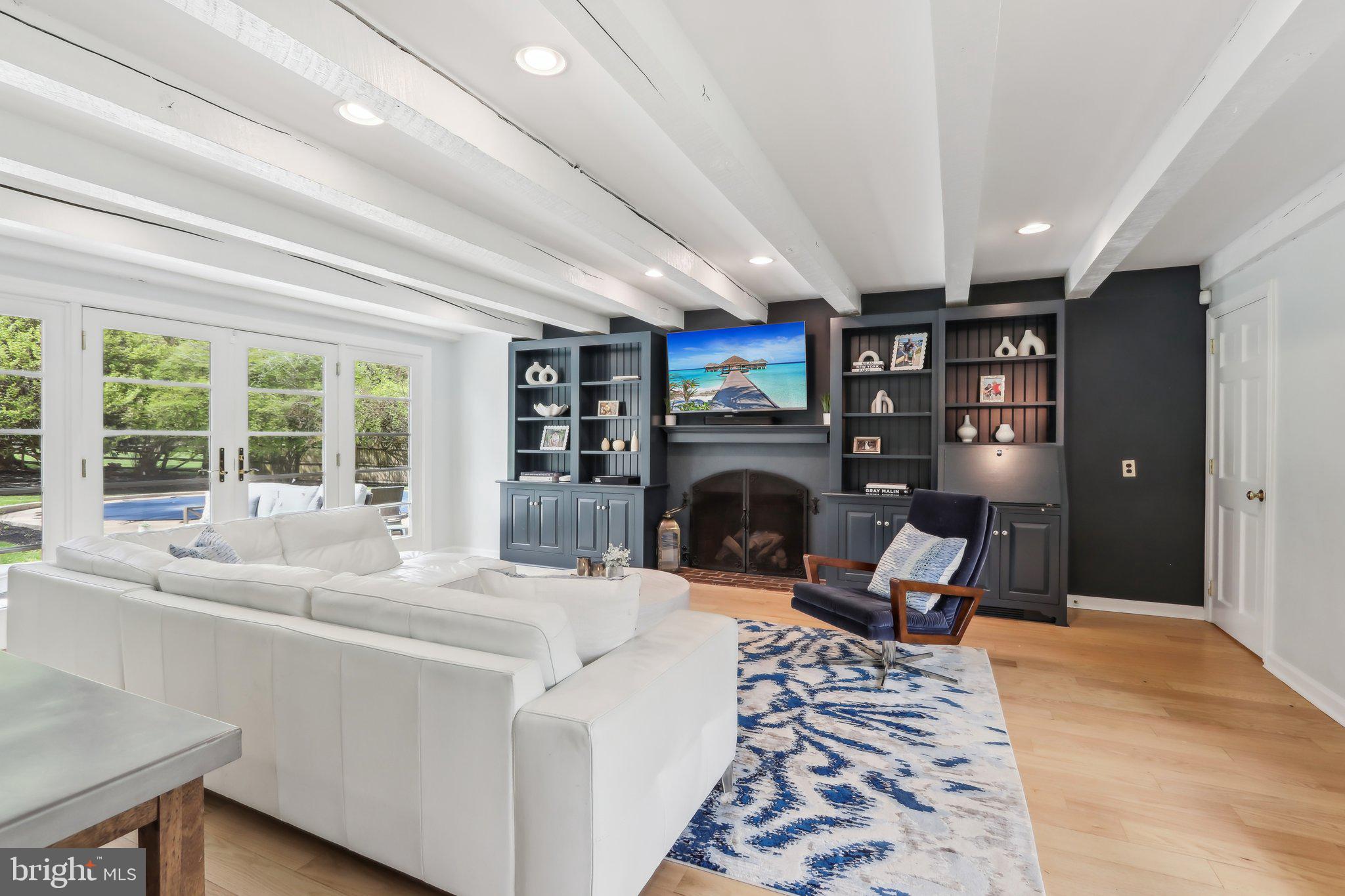 410 North Valley Forge Road Devon, PA 19333 - Photo 21 of 84 a living room with furniture a fireplace and a large window