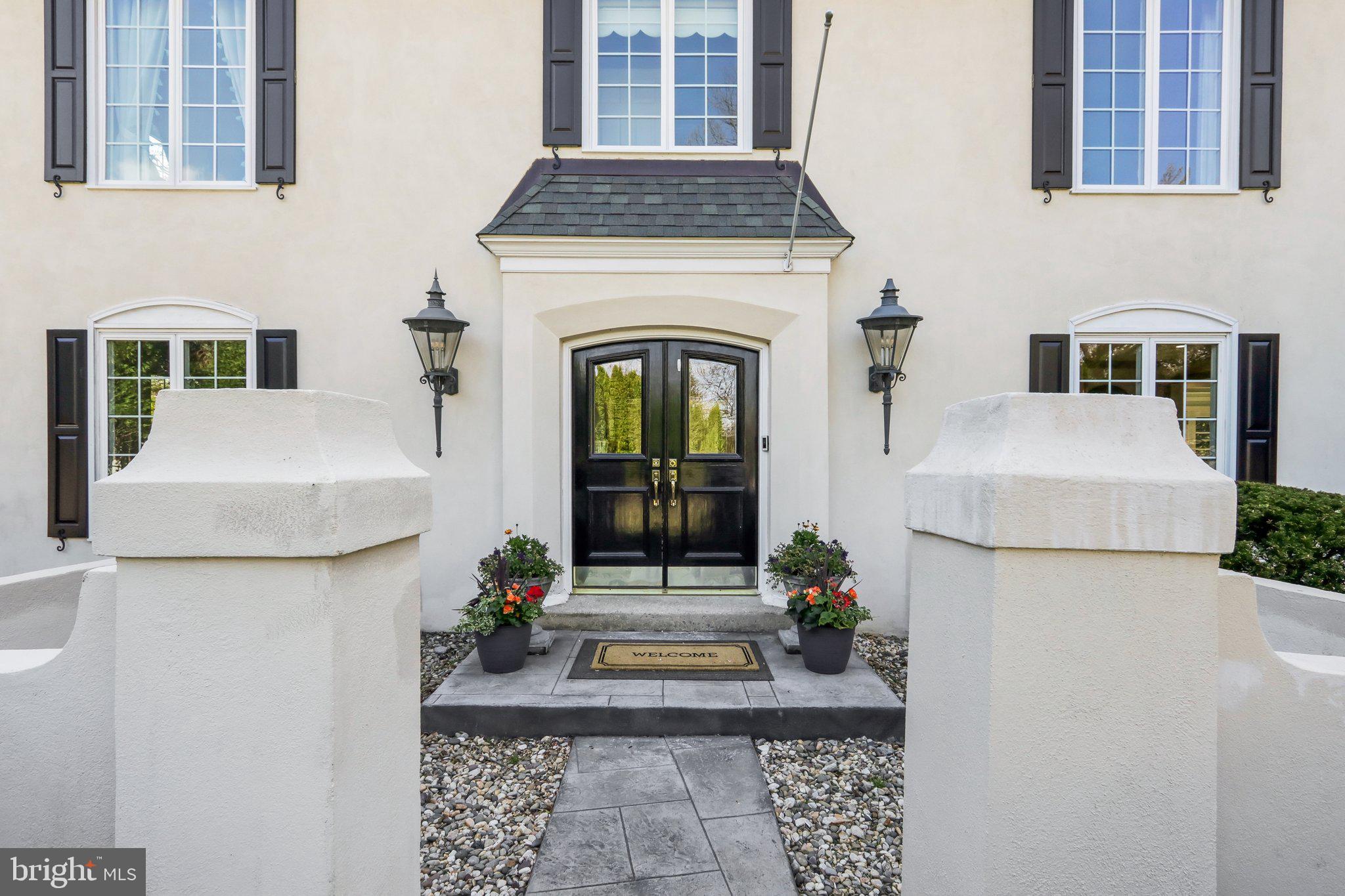410 North Valley Forge Road Devon, PA 19333 - Photo 3 of 84 a living room with a fireplace and a rug