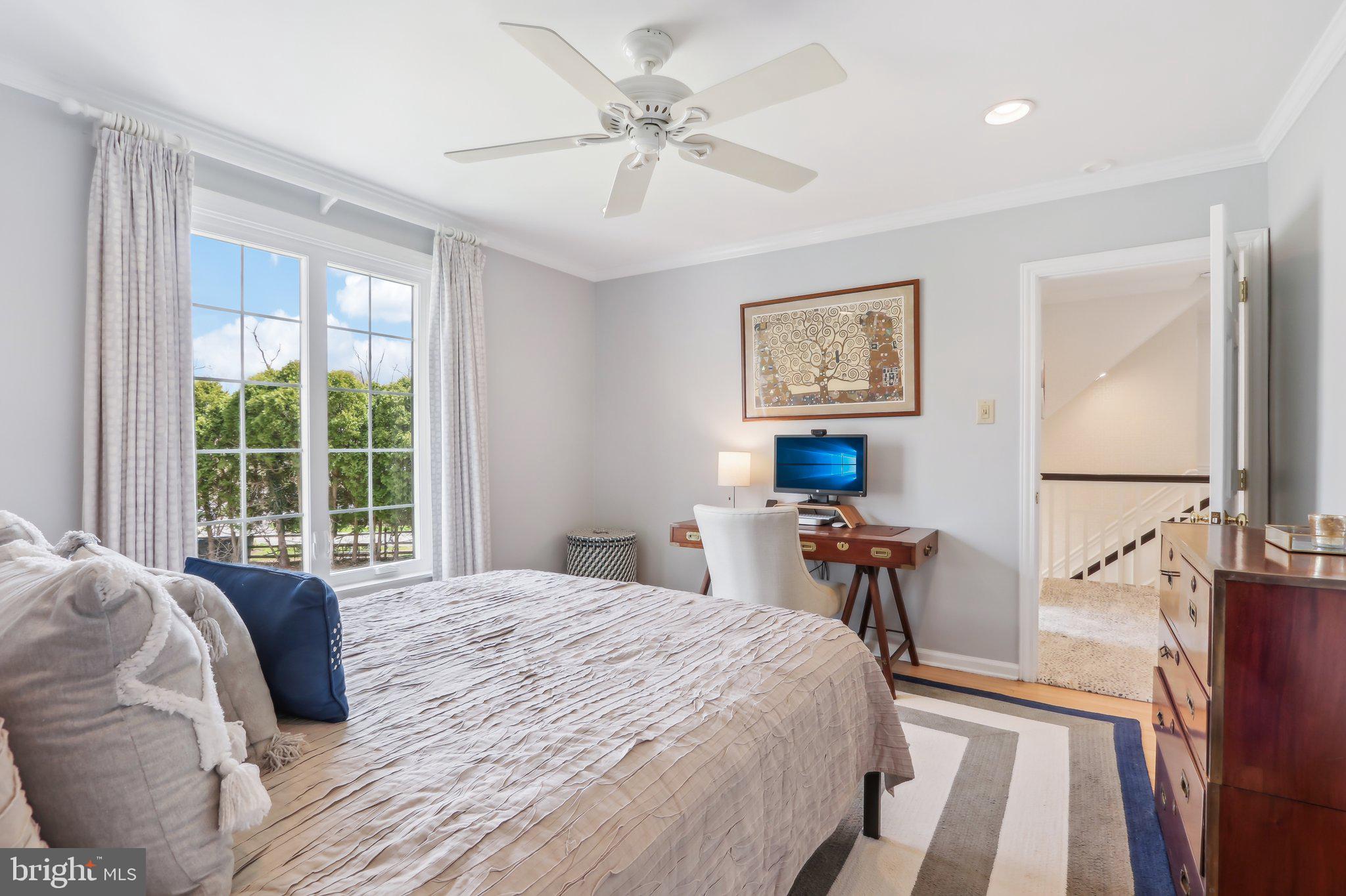 410 North Valley Forge Road Devon, PA 19333 - Photo 52 of 84 a bedroom with a large bed and a chandelier