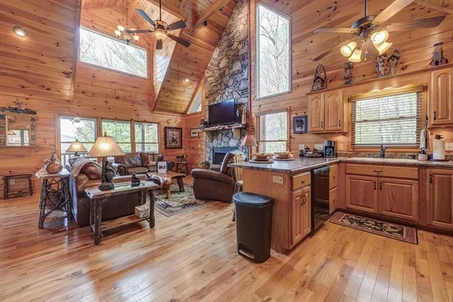 a bedroom with bed and wooden floor
