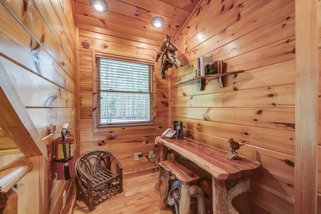 a balcony with wooden floor outdoor seating and city view