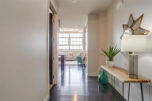 an empty room with chandelier fan