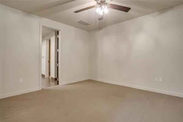 an empty room with a bathroom
