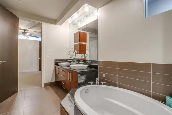 a bathroom with a sink and shower