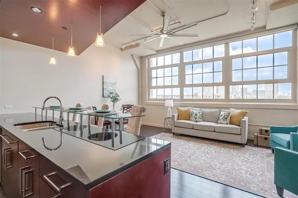 a living room with furniture and a large window