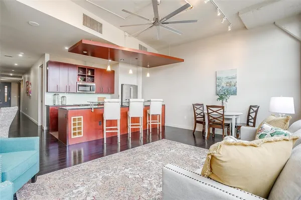a living room with fireplace furniture and a window