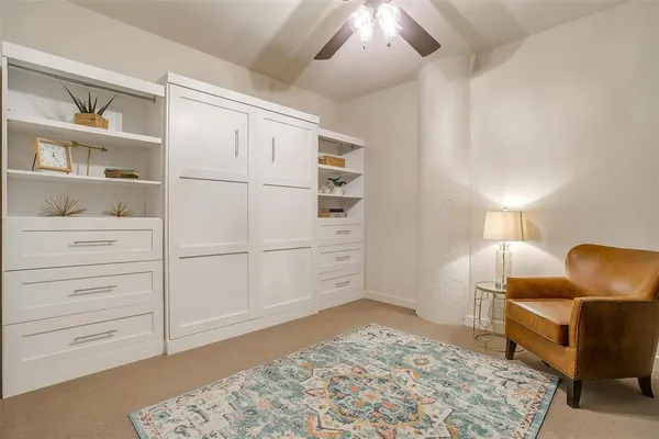 a view of kitchen with cabinets and furniture