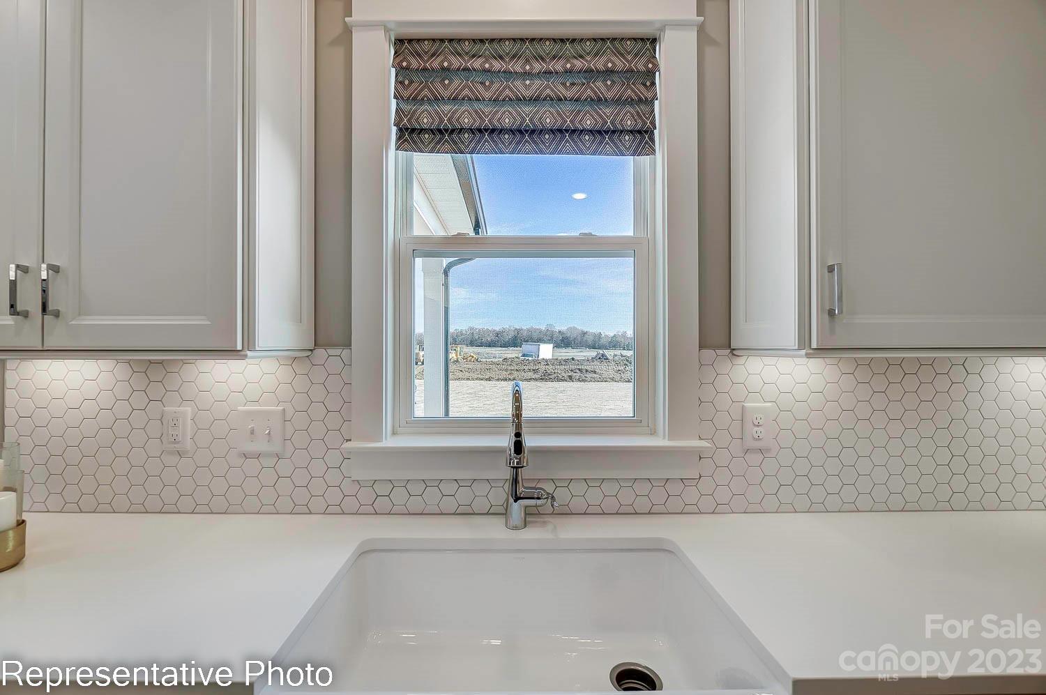 4185 Roberta Road Harrisburg, NC 28075 - Photo 14 of 48 a bathroom with a bathtub