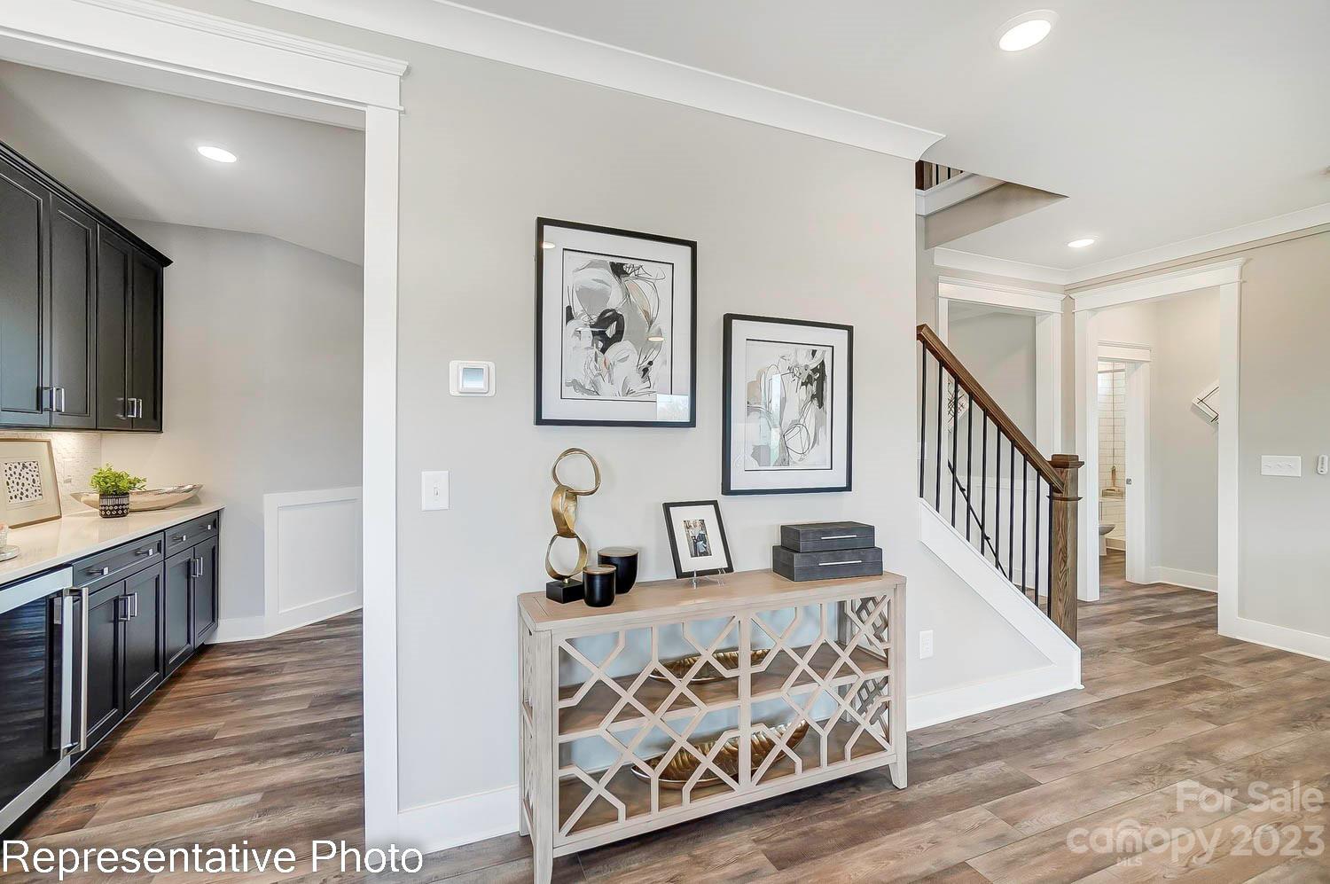 4185 Roberta Road Harrisburg, NC 28075 - Photo 18 of 48 a bedroom with furniture and wooden floor