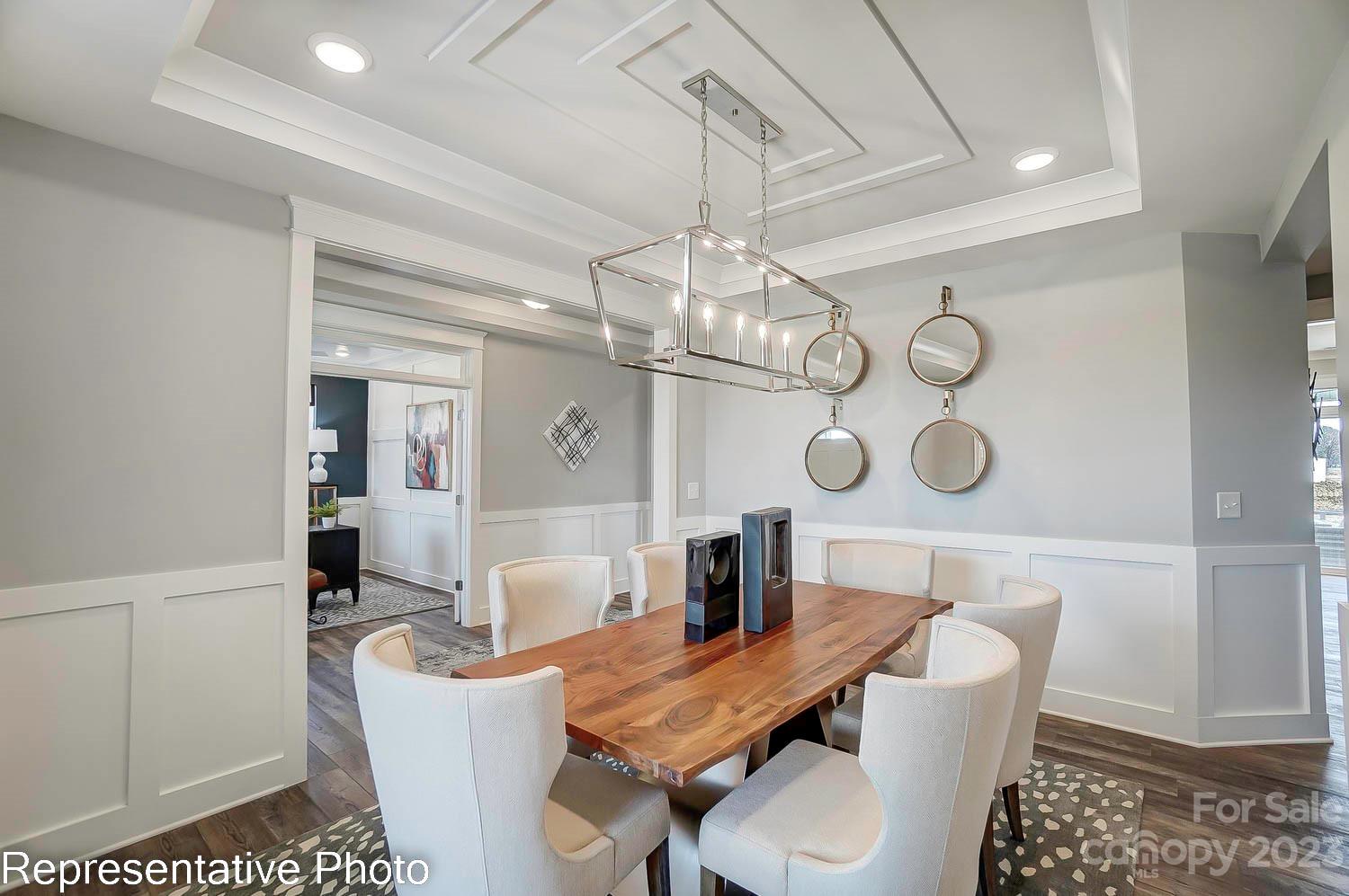 4185 Roberta Road Harrisburg, NC 28075 - Photo 20 of 48 a view of a dining room with furniture and kitchen view