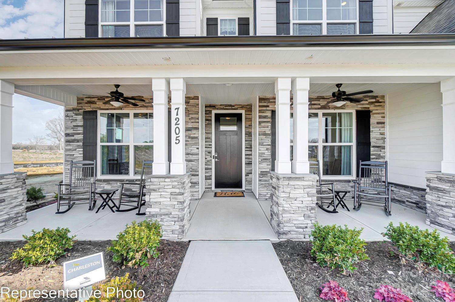 4185 Roberta Road Harrisburg, NC 28075 - Photo 2 of 48 a front view of a building with outdoor seating