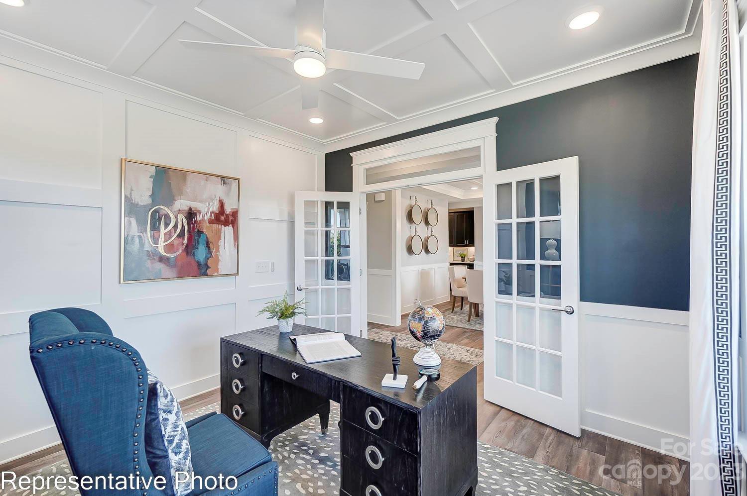 4185 Roberta Road Harrisburg, NC 28075 - Photo 22 of 48 a view of a livingroom with furniture window and wooden floor