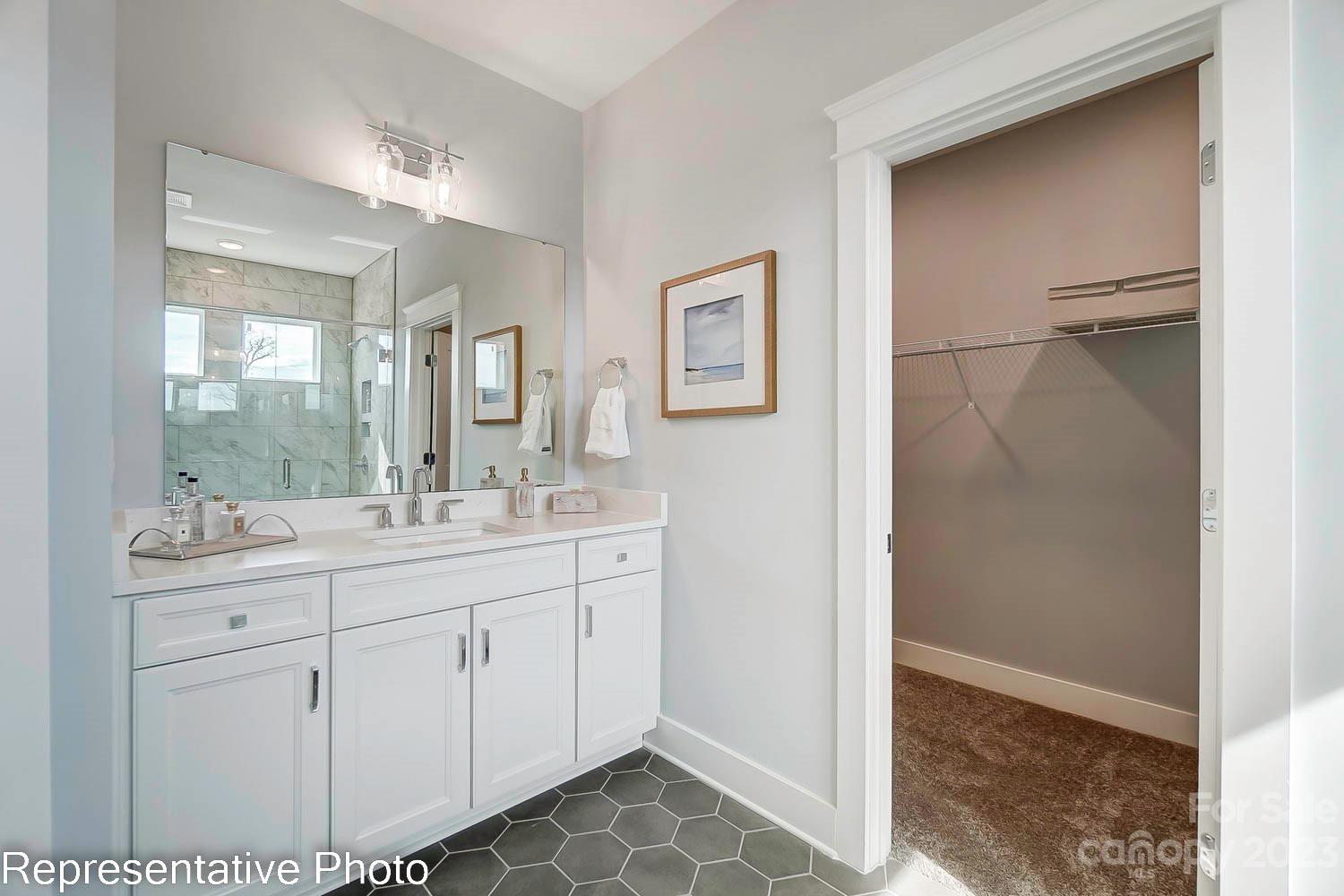 4185 Roberta Road Harrisburg, NC 28075 - Photo 33 of 48 a bathroom with a double vanity sink mirror and