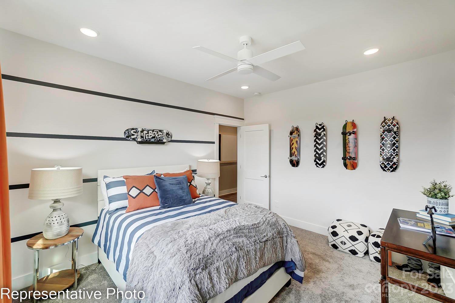 4185 Roberta Road Harrisburg, NC 28075 - Photo 37 of 48 a bedroom with a bed and wooden floor