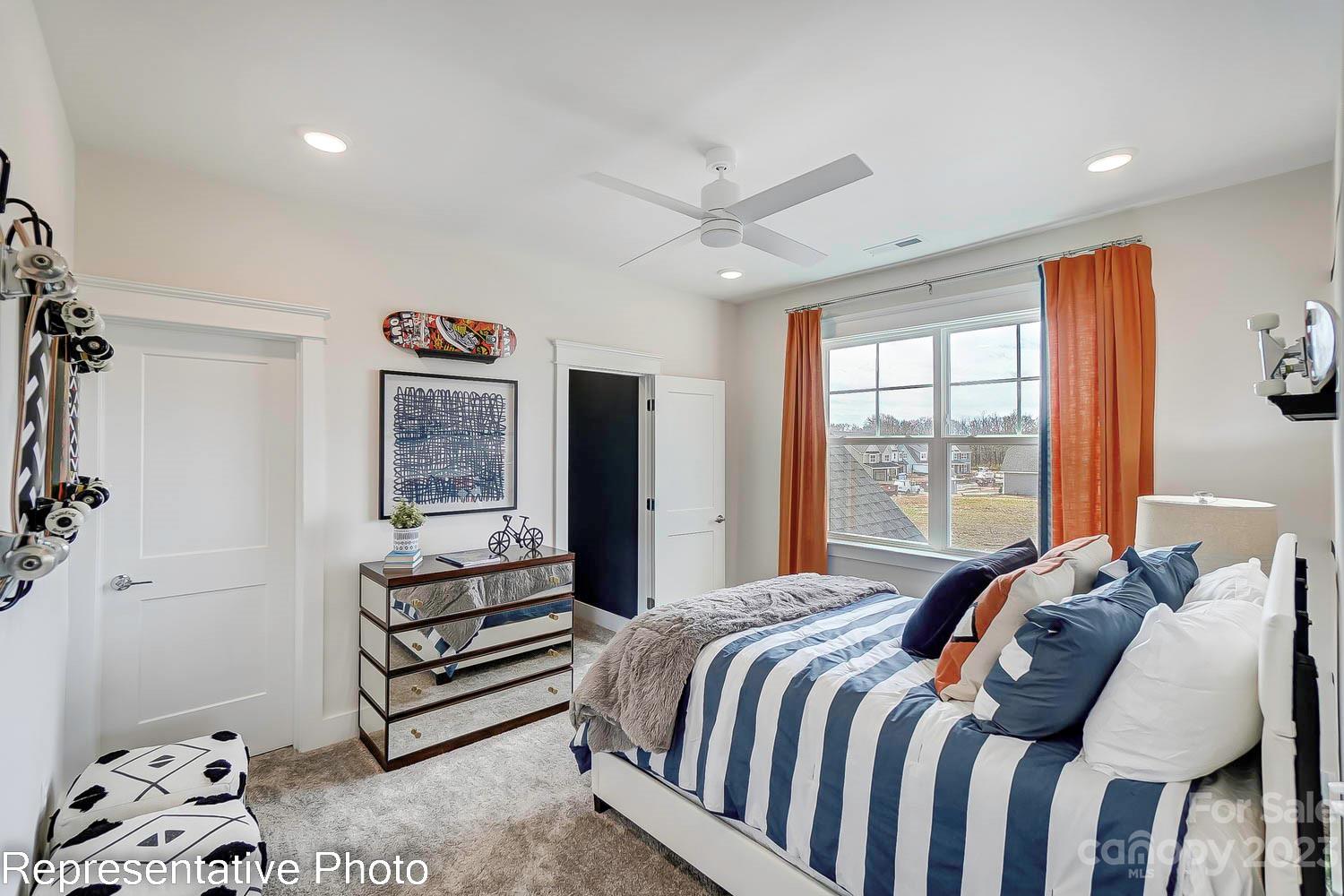 4185 Roberta Road Harrisburg, NC 28075 - Photo 38 of 48 a bedroom with a bed and a window