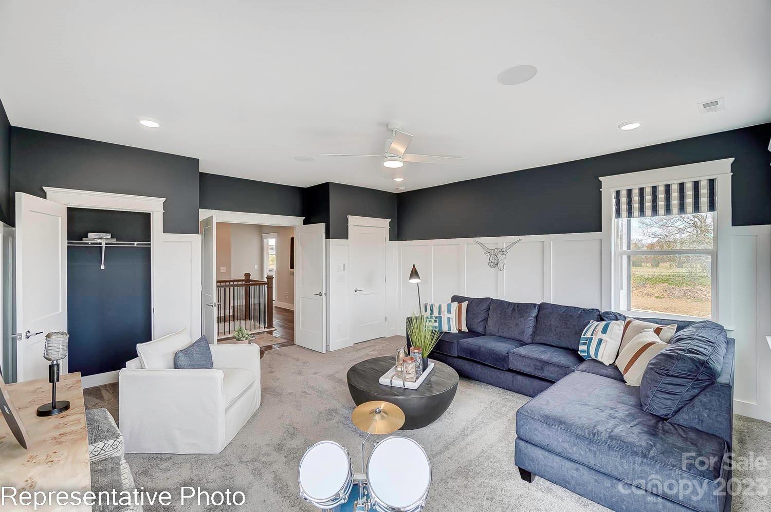 4185 Roberta Road Harrisburg, NC 28075 - Photo 44 of 48 a living room with furniture and a large window