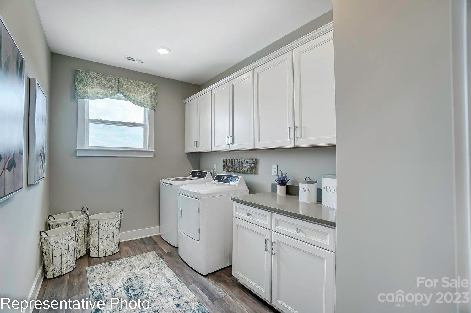 4185 Roberta Road Harrisburg, NC 28075 - Photo 47 of 48 a kitchen with a sink cabinets and window
