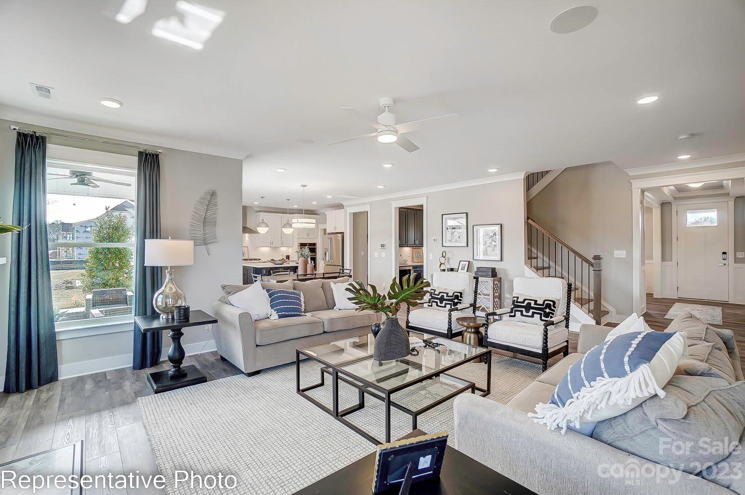 4185 Roberta Road Harrisburg, NC 28075 - Photo 5 of 48 a living room with furniture and a large window