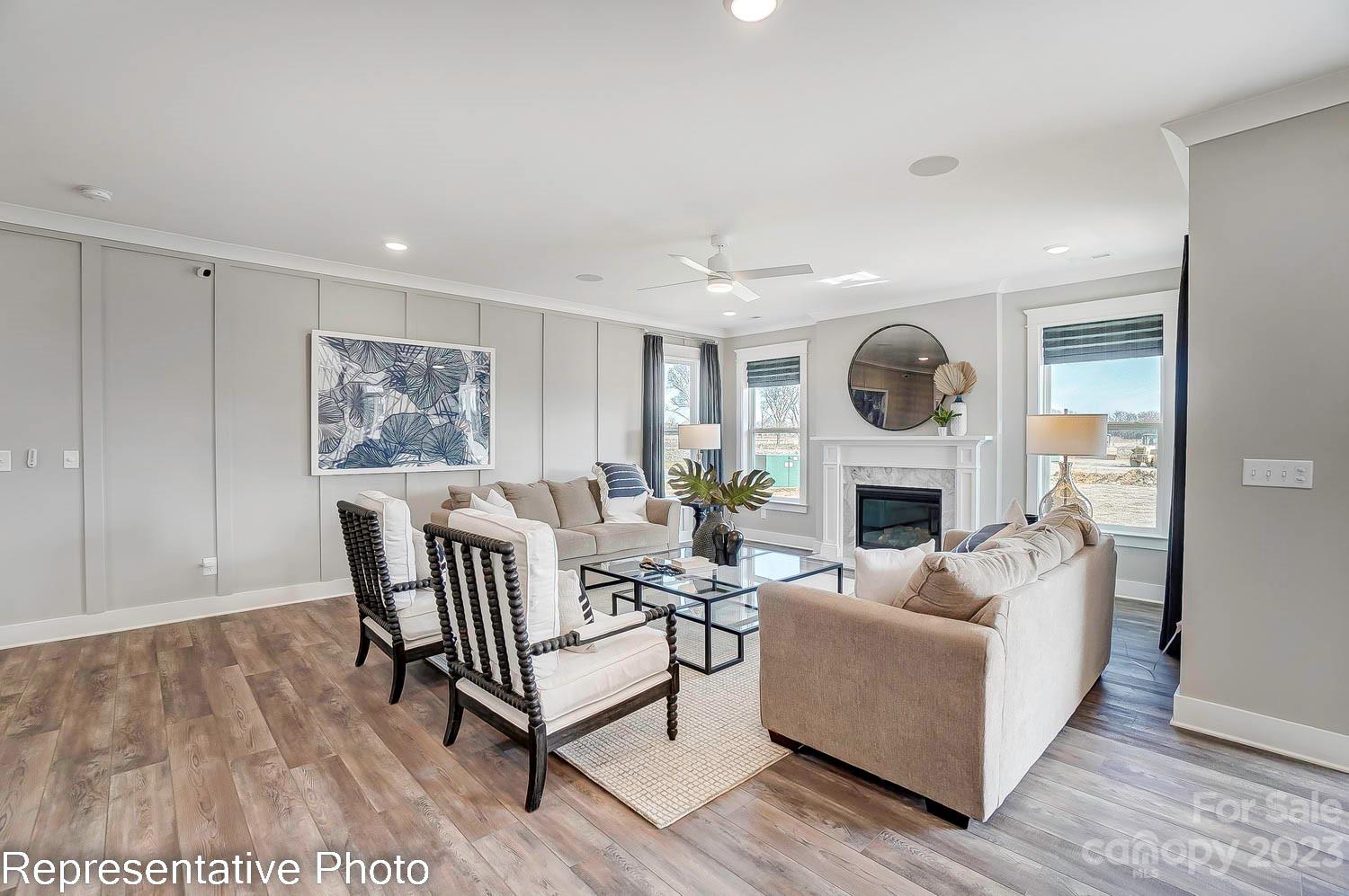 4185 Roberta Road Harrisburg, NC 28075 - Photo 6 of 48 a living room with furniture and a fireplace