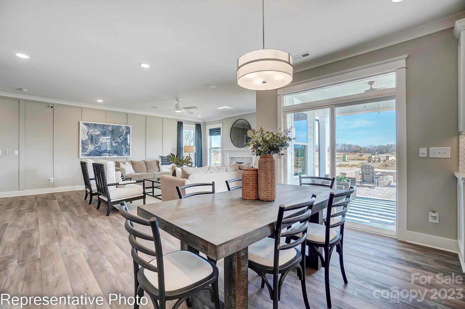 4185 Roberta Road Harrisburg, NC 28075 - Photo 9 of 48 a view of a dining room with furniture window and wooden floor