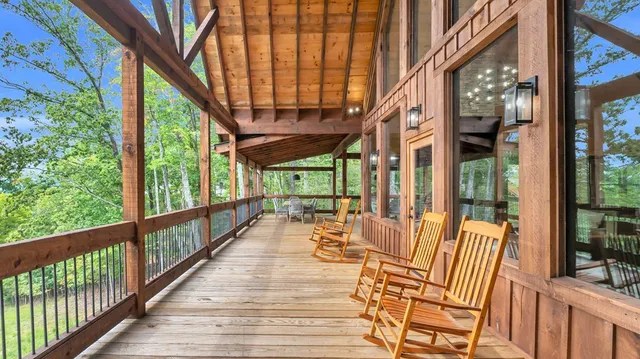 a view of a chair and tables in the balcony