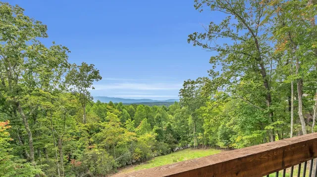 a balcony with furniture and wooden floor