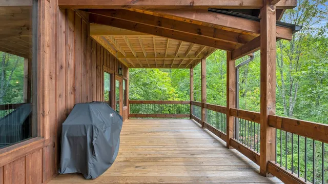 a view of a house with a porch and furniture