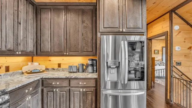 a living room with furniture a flat screen tv and windows