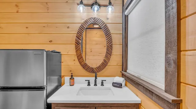 a bathroom with a sink and a mirror