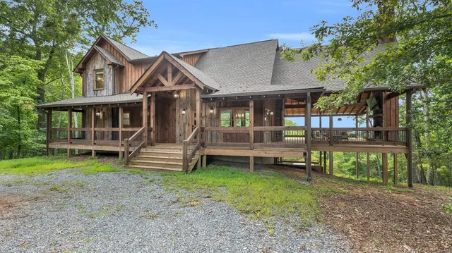 a view of a porch with wooden floor and roof