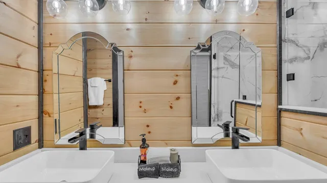 a view of a porch with furniture and floor to ceiling window