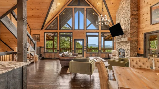 a living room with fireplace furniture and a flat screen tv
