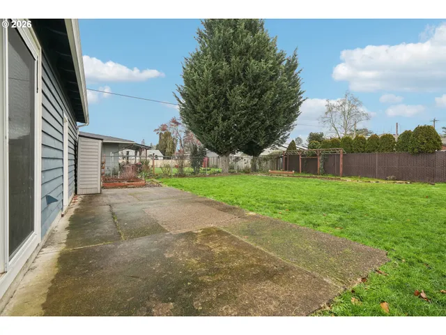 a view of a backyard of the house